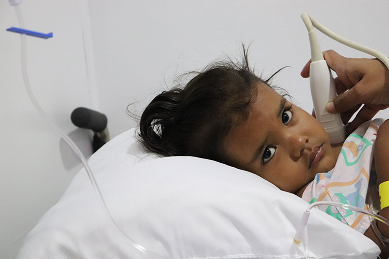 little girl in hospital bed